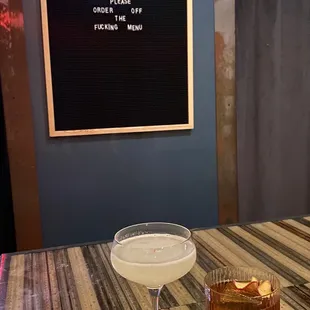 two cocktails on a table