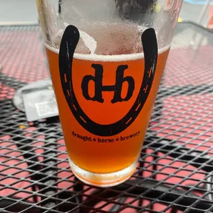 a glass of beer on a table