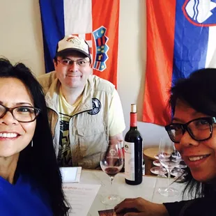 three people sitting at a table