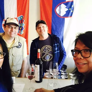 a group of people sitting around a table