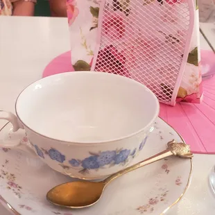 a teacup and saucer on a table