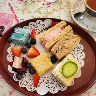 Three tiny sandwiches and three even tinier desserts. We expect tea food to be small, but wow.