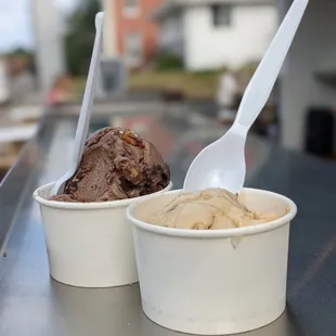 two cups of ice cream and a spoon