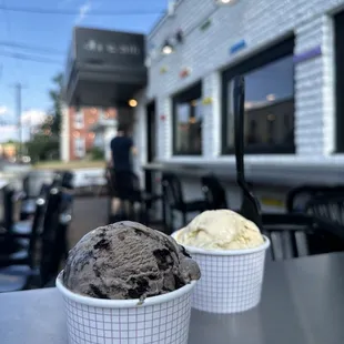 two cups of ice cream on a table