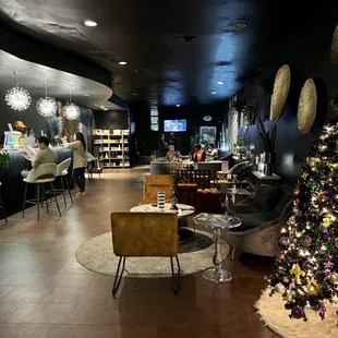 a christmas tree in the middle of the lounge