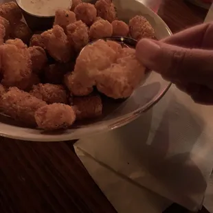 a plate of fried chicken nuggies