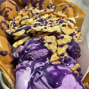Vanilla puffle w/ taro ice cream, waffle bits and ube drizzle