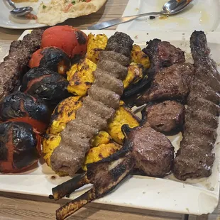Family plate: beef, chicken, lamb and roasted tomatoes