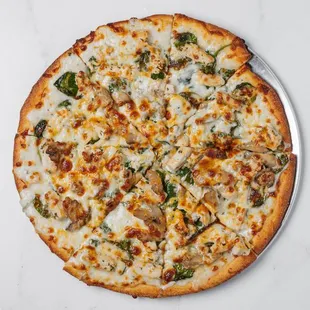 Halal-certified dish with Alfredo sauce, tender baby spinach, halal chicken, mushrooms, and a perfect blend of halal mozzarella and cheddar