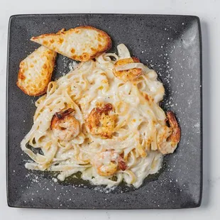 Roasted Chicken Fettuccine Alfredo paired perfectly with Garlic Bread.