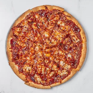 Halal BBQ Chicken Pizza, a perfect blend of BBQ sauce, Halal chicken, onions, mozzarella cheese, and cheddar cheese