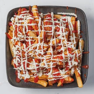 Masala Fries loaded with Crunchy Chicken Tenders, Ketchup and Mayonnaise.