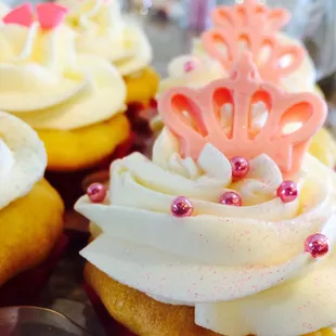 cupcakes with white frosting and pink sprinkles
