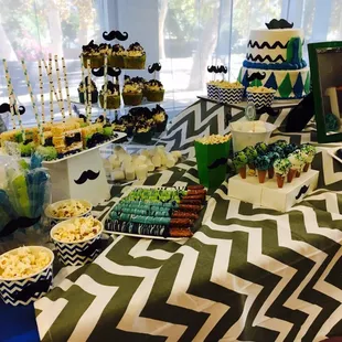 a table of desserts for a boy's birthday party