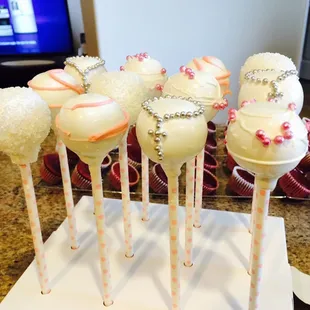 a display of cake pops on a table