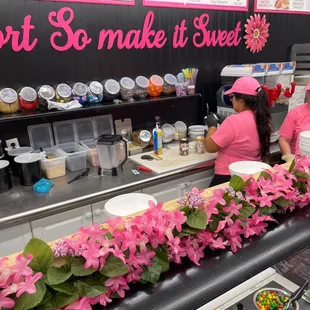 two girls behind a counter