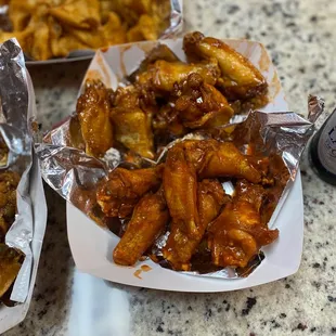 Honey Sriracha &amp; Buffalo lemon pepper Parmesan wings.