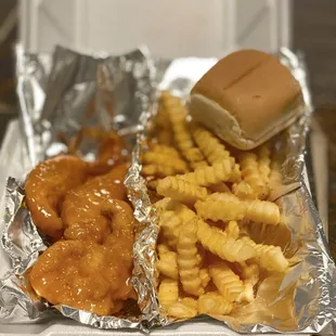 a tray of french fries and a sandwich