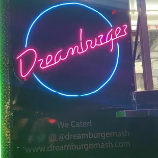 a neon sign that reads dreamburger