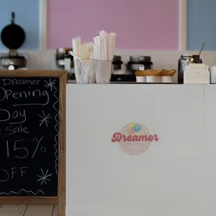 a chalk board with a chalkboard sign in front of it