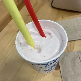 Strawberry banana milkshake with fresh fruit