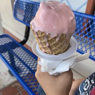 Waffle cones with strawberry, vanilla, and chocolate layers