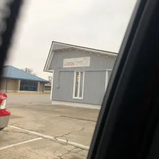 a red car in a parking lot