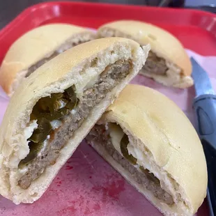 Sausage patty with cheese and picked jalapeños