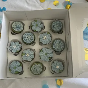 Blue mini cupcakes for a baby shower.