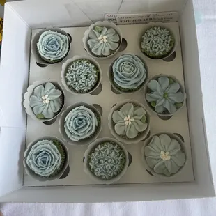 Blue mini cupcakes for a baby shower.