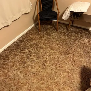 Dirty floors. Stained chair.
