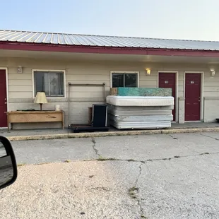 Furniture stacked outside.