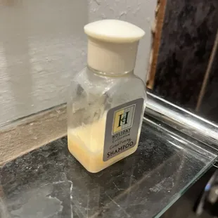 Half used bottle of shampoo.