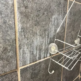 Soap scum on wall.