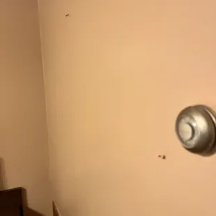 Thumbtacks in the wall for some reason?