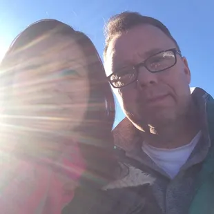 Sunny yet cold at the stadium, long line for tickets, long winding line to get in.