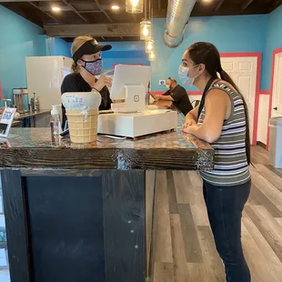 A staff helping a costumer