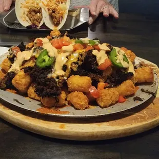 Tater tot nachos....Cuban pork is the meat on top. Absolutely delicious.