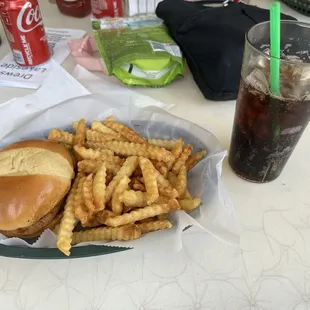Spicy chicken sandwich with fries and Coca Cola