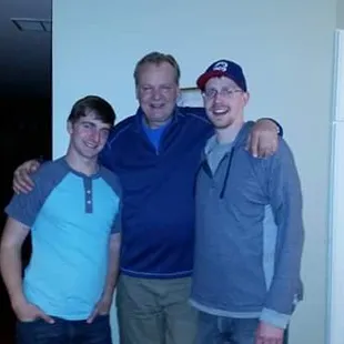 three men posing for a picture