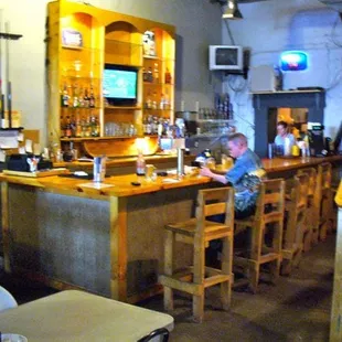 a little boy sitting at the bar