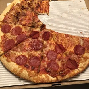 a half eaten pepperoni pizza