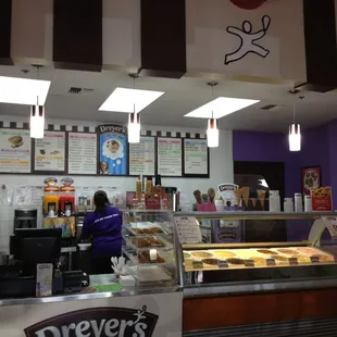 a woman behind the counter