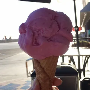 a person holding an ice cream cone