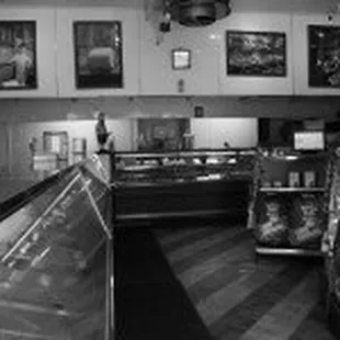 a black and white photo of a grocery store