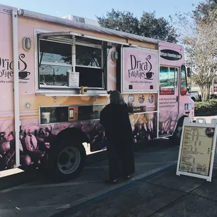 a woman standing in front of a truck