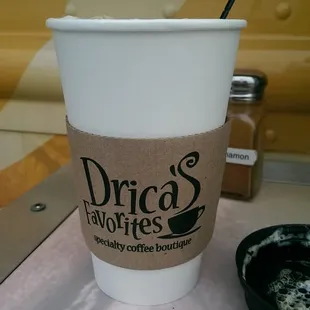 a cup of coffee and a spoon