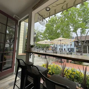 a patio with tables and chairs