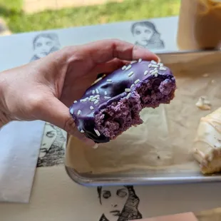 Ube donut "cross-section" via a couple of bites-- it's purple on the inside, too!