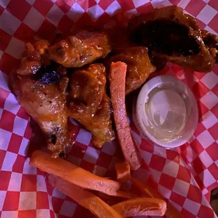 Garlic Parmesan (cooked on the flat grill) and then tossed in Buffalo sauce, with carrots.